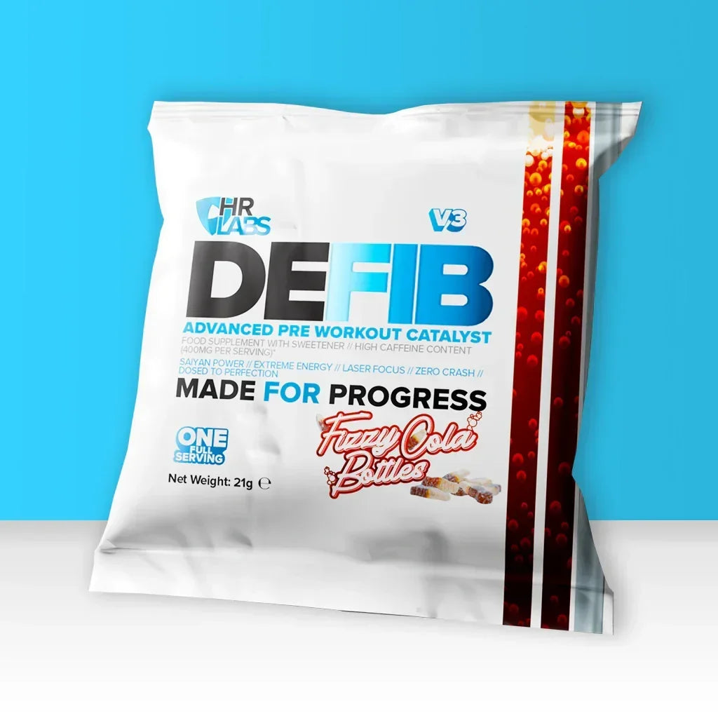 Pre-workout supplement sachet labeled Defib Fizzy Cola Bottles flavor on blue background